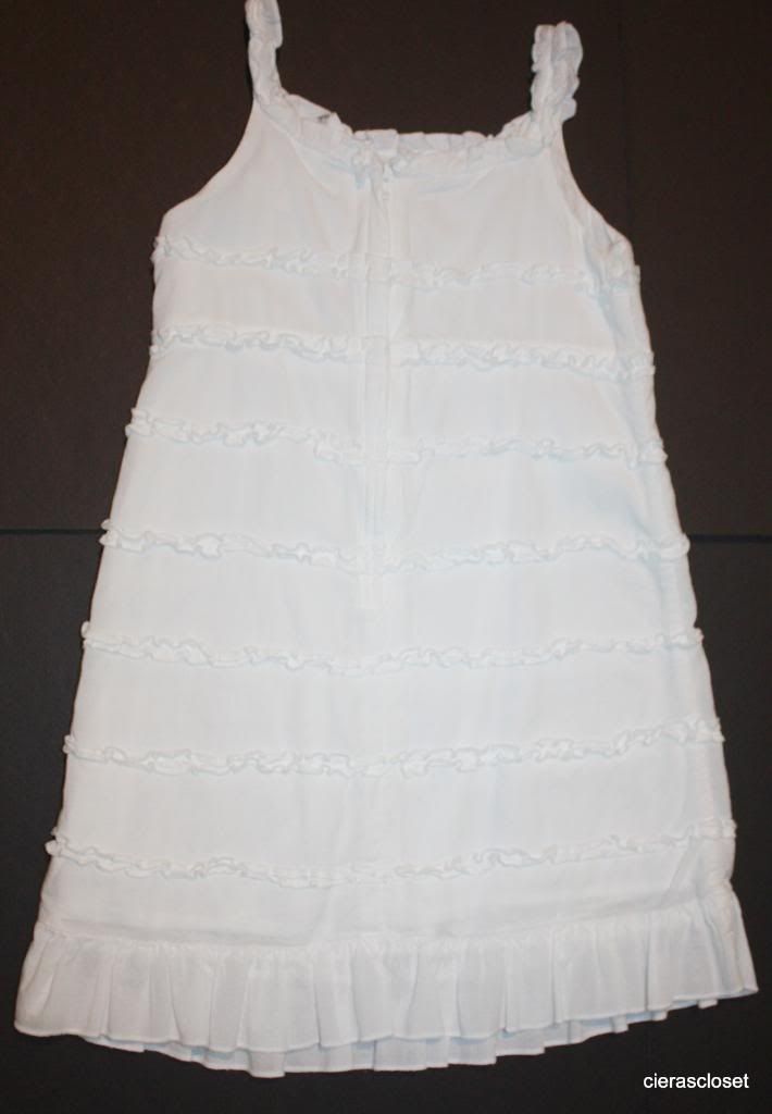 Old Navy white dress with ruffles. The dress zips down the back. We ...